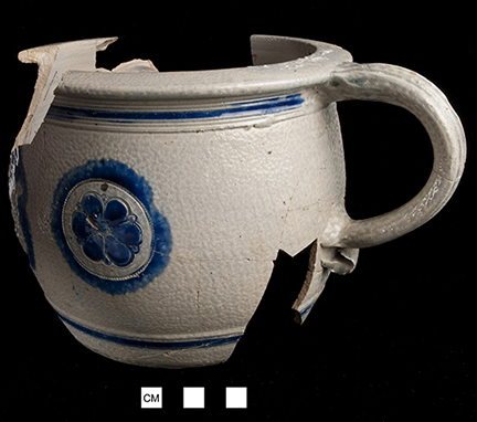 Gray-bodied salt glazed stoneware  jug  with applied lions outlined with cobalt-blue under the glaze.  Both sherds appear to be from the same vessel. Lot number: 18CV60-1.428.